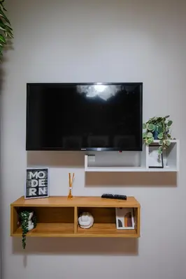 a flat screen tv hanging on a wall at Tom Thumb & Thumbelina - 2 Private Rooms in Sofia Center by Flat Mаnager in Sofia