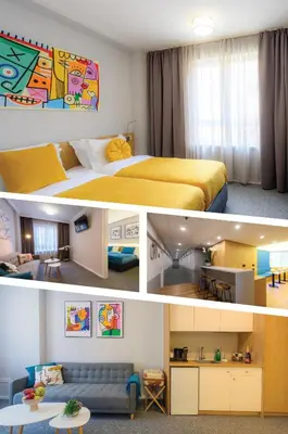 a hotel room with a bed and a living room at LOCATION in Sofia