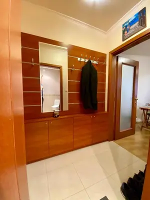 a dressing room with a mirror and a robe at Sofia Cozy Retreat in Sofia