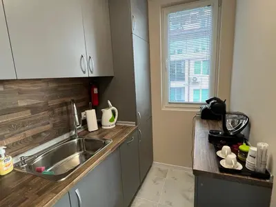 a kitchen with a sink and a counter top at Апартамент Комфорт 2 Близо до Летището in Sofia
