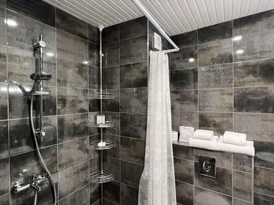 a bathroom with a shower with a shower curtain at Апартамент Комфорт 2 Близо до Летището in Sofia
