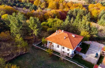 an overhead view of a house with an orange roof at ВИЛА МАРИНОВИ in Boykovo