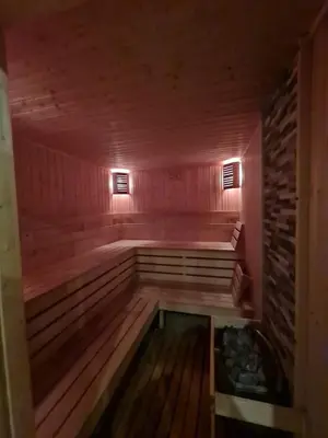a room with a sauna with a tub in it at Aspen Golf D 401 in Bansko