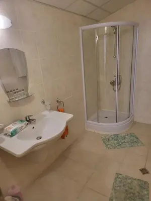 a bathroom with a sink and a shower at Aspen Golf D 401 in Bansko