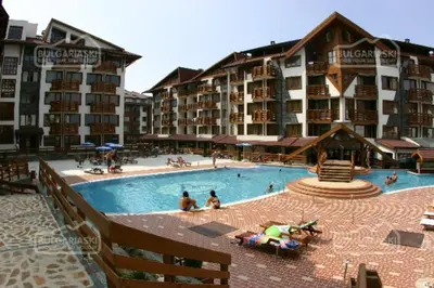 a large swimming pool in front of a hotel at Belvedere Holiday Club ,apartment A202 in Bansko