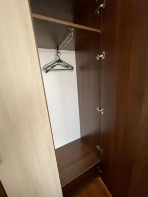 a closet with a wooden door and a hanger at Belvedere Holiday Club ,apartment A202 in Bansko