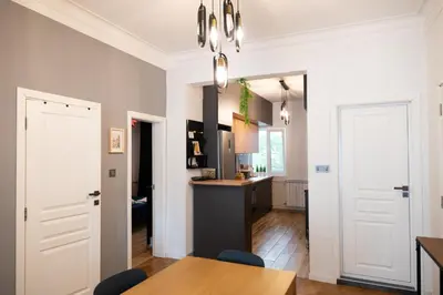 a kitchen and dining room with a table and chairs at Perfect Long-term Stay Stylish and Spacious Top Center Next to Vitosha Blvd in Sofia