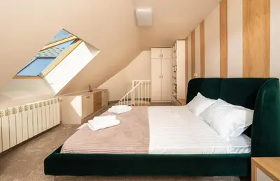 a bedroom with a large bed with a large window at Modern Maisonette - 2 Bedrooms - Terrace - Vitosha View in Sofia