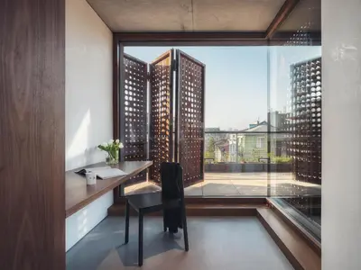 a room with a desk and a view of a city at DOT Sofia in Sofia