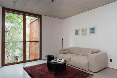 a living room with a couch and a table at DOT Sofia in Sofia