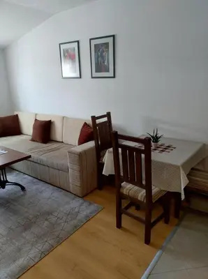 a living room with a couch and a table at Gondola lift apartment 5402 in Bansko