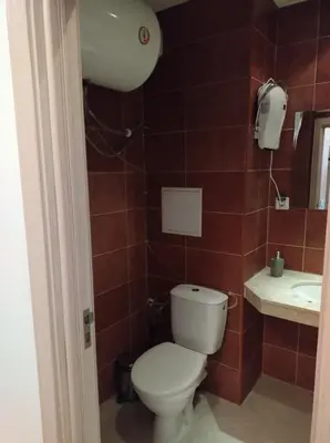 a bathroom with a toilet and a sink at Gondola lift apartment 5402 in Bansko