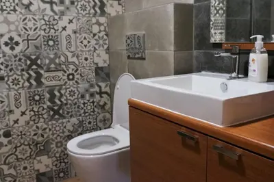 a bathroom with a white sink and a toilet at 