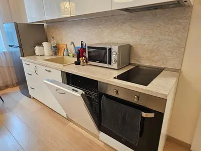 a kitchen with a sink and a microwave at Tsar Asen 21 in Sofia
