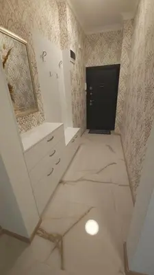 a bathroom with a staircase leading to a black door at Tsar Asen 21 in Sofia
