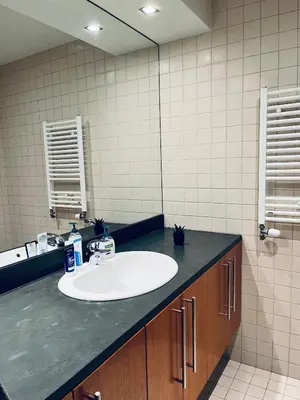 a bathroom with a sink and a mirror at Forest nest - your place to rest! in Borovets