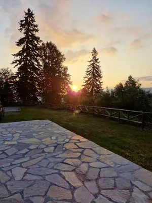 a stone walkway with the sunset in the background at Къща за гости Донука in Panichishte