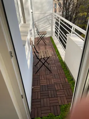 a balcony with a bench and a railing at Dreamy Apartment Near To The Center in Sofia
