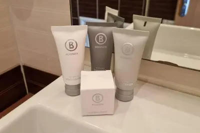 a group of three bottles ofodorizers on a bathroom counter at BH & Semiramida Ski Apartment in Borovets