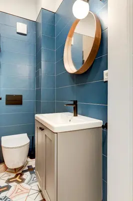 a bathroom with a white sink and a mirror at Sofia's Elegant Urban Retreat in Sofia