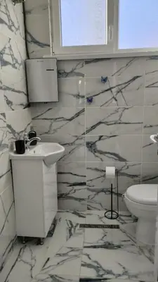 a bathroom with a sink and a toilet at Tea House Samokov in Samokov