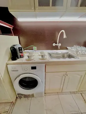 a kitchen with a sink and a washing machine at 2 Bedroom Apartment with Garage in Sandanski