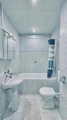a bathroom with a sink and a toilet and a tub at 2 Bedroom Apartment with Garage in Sandanski