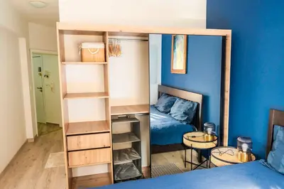 a room with a bunk bed and a bedroom with a mirror at Large Stylish 2-bedroom apt near ski road, 5 min to Gondola & Bar Street in Bansko