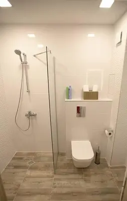 a bathroom with a shower and a toilet in it at Modern Turquoise Apartment/free WiFi in Sofia