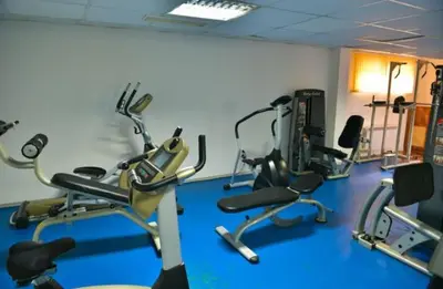 a gym with several exercise bikes in a room at VIP Apartments Belvedere with terrace K105 in Bansko