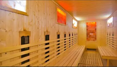 a room with wooden benches in a building at VIP Apartments Belvedere with terrace K105 in Bansko