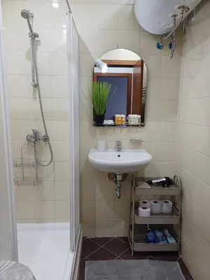 a bathroom with a sink and a shower at Ski Lift Apartment - Complex Gramadeto Bansko in Bansko