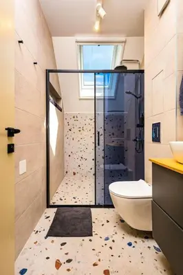 a bathroom with a shower with a toilet and a sink at Hills View Central Apartment in Plovdiv