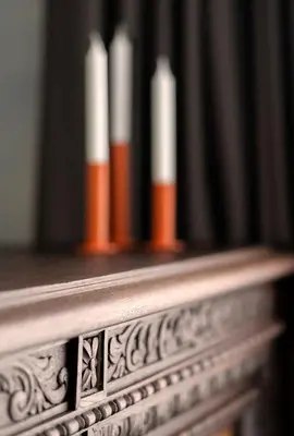 a row of candles sitting on a wooden shelf at NEW High-End Designer 3BR Central Apt Free Parking in Sofia