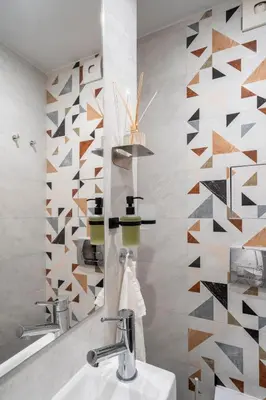 a bathroom with a sink and a mirror at NEW High-End Designer 3BR Central Apt Free Parking in Sofia
