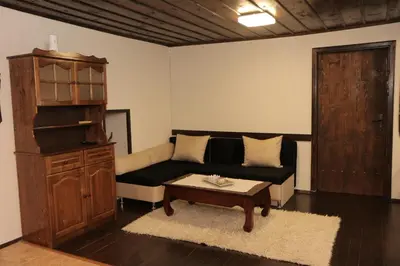 a living room with a couch and a coffee table at Vila Toplika in Kara Agach