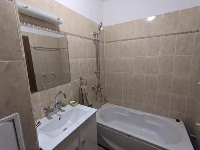 a bathroom with a tub and a sink and a bath tub at Sapphire Mountain 1 in Bansko