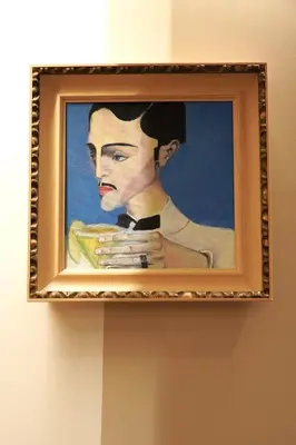 a painting of a woman is hanging on a wall at Bansko Nest in Bansko