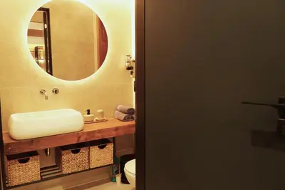 a bathroom with a sink and a mirror at Bansko Nest in Bansko