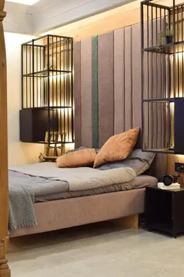 a bed with two pillows on it in a room at Bansko Nest in Bansko