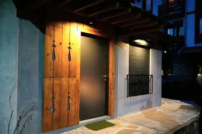 a door on the side of a building at Bansko Nest in Bansko