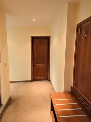 an empty room with a door and a table at Great View Apartment near Gondola in Bansko
