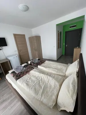 a bedroom with a large bed in a room at ZaraApartHotel in Sofia