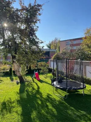 a park with a swing set in the grass at ZaraApartHotel in Sofia