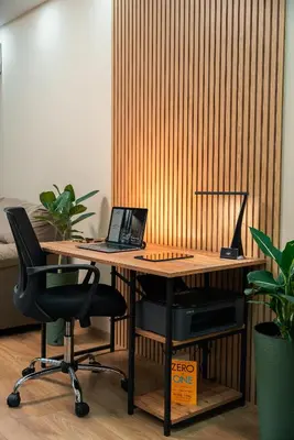 an office with a desk with a laptop and two chairs at One-Bedroom apartment with Free Street Parking, Free Gym Pass and Office Setup in Plovdiv