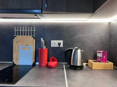 a kitchen with a counter top with a coffee maker at Harmony apartment in Sofia