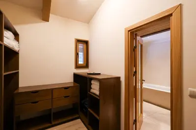 a bathroom with a wooden cabinet and a sink at Villa Katerina Deluxe w Sauna - Pirin Golf and Country Club in Bansko