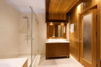 a bathroom with a sink and a shower at Villa Katerina Deluxe w Sauna - Pirin Golf and Country Club in Bansko