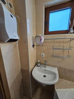 a small bathroom with a sink and a window at VIVA 4-A-16 ski to the door Grand Monastery in Pamporovo