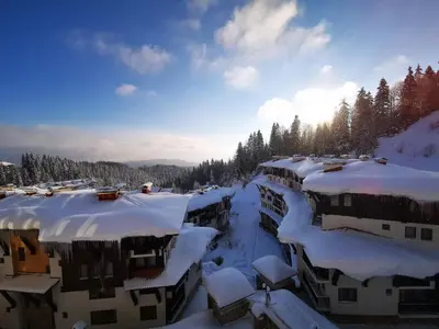 a row of houses covered in snow at VIVA 4-A-16 ski to the door Grand Monastery in Pamporovo
